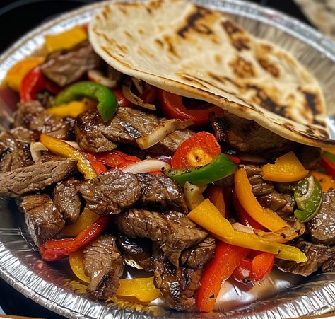 Classic Steak Fajitas are a flavorful and easy-to-make dish, perfect for a family dinner or a casual gathering. This recipe combines marinated and perfectly seared steak with sautéed bell peppers and onions, all wrapped in warm tortillas. A squeeze of lime juice, fresh cilantro, and optional toppings like sour cream, salsa, and avocado make each bite irresistible. Whether you're a seasoned cook or new to making fajitas, this guide will walk you through each step to create a delicious, ... Sweet Banana Bread Recipe, Steak Fajitas Recipe, Balsamic Carrots, Broccoli Pasta Recipe, Steak Fajita Recipe, Fajitas Recipe, Sauteed Peppers, Hamburger Soup, Sliced Steak