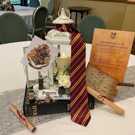 Hogwarts Table Decor, Hogwarts Centerpiece Ideas, Harry Potter Wedding Reception Ideas, Harry Potter Boutonniere, Harry Potter Themed Quinceanera, Harry Potter Floral Arrangements, Harry Potter Center Piece, Harry Potter Table Centerpieces, Barnyard Wedding Reception