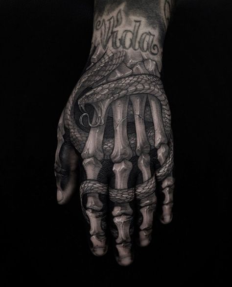 14 Horror Themed Tattoo Ideas For Your Next Tattoo Shop Visit Bone Hand Tattoo, Herren Hand Tattoos, Feminine Skull Tattoos, Bone Hand, Skull Hand Tattoo, Gangsta Tattoos, Hand Tats, Skeleton Tattoos, Half Sleeve Tattoos For Guys