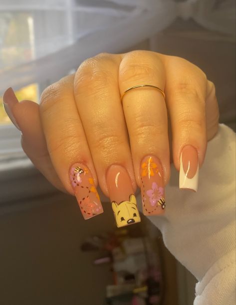 A nude gel-x tapered square nail set with Winnie the Pooh and light spring themed art Nail Ideas Characters, Cute Winnie The Pooh Nails, Whitney The Pooh Nails, Whinney Pooh Nails, Winnie The Pooh Valentines Day Nails, Summer Nails Disney, Artist Nails Design, Pooh Bear Nails Acrylic, Winnie The Pooh Inspired Nails