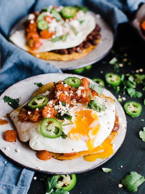 Huevos Rancheros Tostadas makes a great breakfast for dinner, or bunch meal. Topped with black beans, a from scratch salsa, then topped with a fried egg cojita cheese and serrano peppers Cojita Cheese, Serrano Peppers, Healthy Egg Breakfast, Brunch Bread, Macro Meals, The Best Breakfast, Best Breakfast Recipes, Breakfast Of Champions, Savory Breakfast