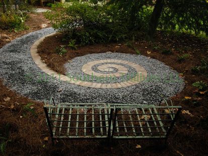 a secret garden that we designed and installed for a client the guest enters the, gardening, landscape, A secret garden design borrowed from nature a fern frond Labyrinth Garden, Mosaic Stones, Cement Projects, Spiral Garden, Incredible Architecture, Courtyard Ideas, Patio Pergola, A Secret Garden, Fern Frond