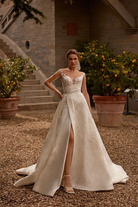 Cypress.A bride will look incredibly stunning in an ivory A-line dress. A corset has a V-neck and a nude-colored mesh tank top. The translucent upper Shimmer Wedding Dress, Daria Karlozi, Chic Bridal Gown, Design Article, Dress Satin Bridesmaid, Convertible Bridesmaid Dress, Trumpet Wedding Dress, V Neck Wedding Dress, Red Evening Dress