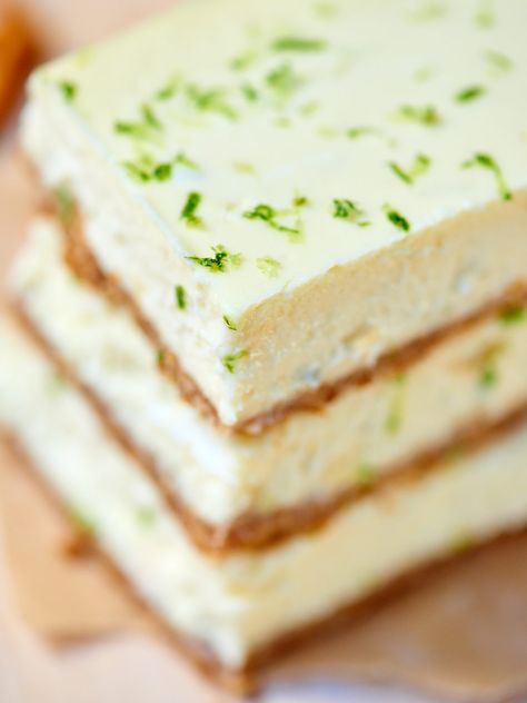 These tequila lime cheesecake bars are perfect for celebrating National Margarita Day! The slightly crunchy pretzel crust mimics the salty rim on a margarita and the cheesecake filling is so creamy and filled with cream cheese, lime juice, tequila, and grand mariner! It’s like eating your favorite margarita in bar form! ;) showmetheyummy.com #tequila #grandmariner #margarita #cheesecake #bars #pretzels #lime Margarita Cheesecake, Lime Cheesecake Bars, Tequila Cake, Pretzel Bars, Margarita Day, Yummy Cheesecake, National Margarita Day, Pretzel Crust, Lime Margarita