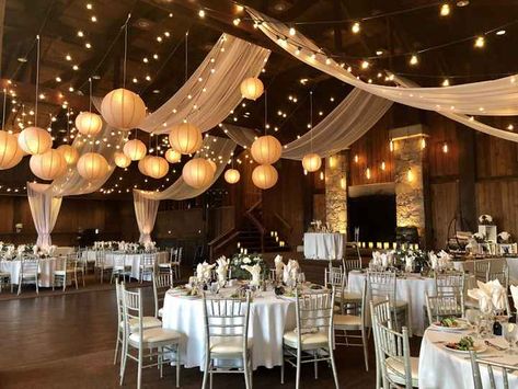 Rustic Hall Wedding Decor, Wedding High Ceiling Decor, Draped Fabric Wedding Decor, Wedding Decorations Lanterns, Wedding In A Gymnasium, Wedding Reception Lanterns, High Ceiling Wedding Decor, Vintage Wedding Venues Rustic, Wedding Inside Decorations