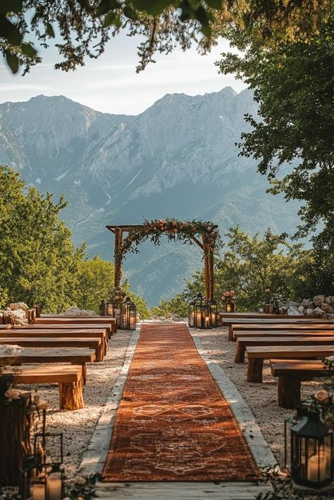 A rustic boho mountain retreat provides a breathtaking backdrop of rugged landscapes, ideal for boho wedding ideas that incorporate natural grandeur. The raw beauty of the mountains enhances the boho theme with elements like wooden arches and earth-toned palettes. This venue offers a unique combination of adventure and romance, suitable for couples who love the great outdoors. Click to see more rustic boho mountain wedding ideas. Wedding Inspo Mountain, Indian Wedding In Mountains, Summer Wedding Mountains, Hawaii Mountain Wedding, Redwood Wedding Venues, Outdoor Wedding Themes Color Schemes, Wedding In The Mountains Colorado, Mountain Beach Wedding, Wedding Inspo Rustic