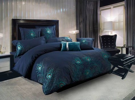 Peacock Feather by Seasontex is one of the most popular bedding patterns that we offer, and it is no wonder why. The rich blue background is embroidered with amazingly detailed peacock feathers in shades of silver and jade that seem to float. The embroidery is perfectly positioned from the foot of the bed and also on the pillow sham(s). These 100 percent cotton 300 thread count bedding sets include the fitted sheet, pillow sham (s), pillow case (s) and decorative pillow cover. Available in si... Navy Blue Duvet Cover, Peacock Bedroom, Peacock Bedding, Blue Comforter Sets, Blue Comforter, Blue Duvet, Peacock Decor, Blue Duvet Cover, Luxury Bedding Sets