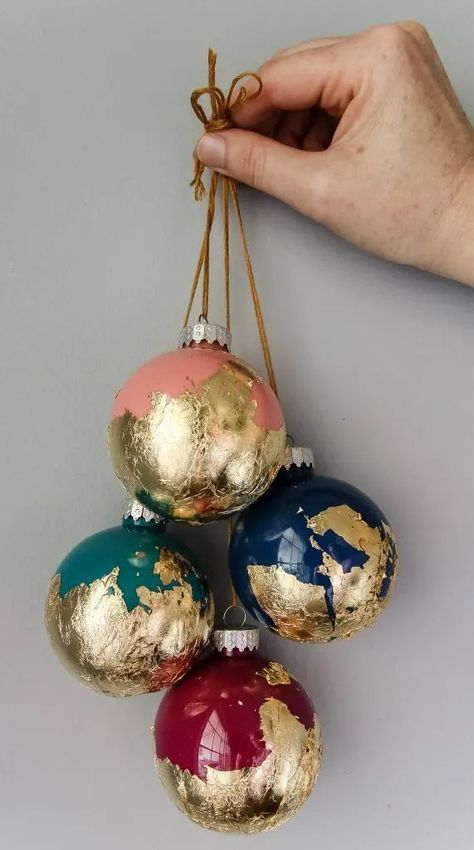 Looking for a way to add a touch of glam to your Christmas decor? You will love these Gold and silver foil holiday crafts! Learn how to make painted ball ornaments dipped in gold foil! #charlestoncrafted #goldfoil #silverfoil #christmas #christmascrafts #christmasornaments #treetopper Christmas Decor Ideas Silver And Gold, Gold Leaf Christmas Ornaments, Painted Ball Ornaments, Diy Outdoor Christmas Decor, Gold Foil Diy, Making Christmas Ornaments, Diy Foil, Leaf Projects, Kid Friendly Crafts