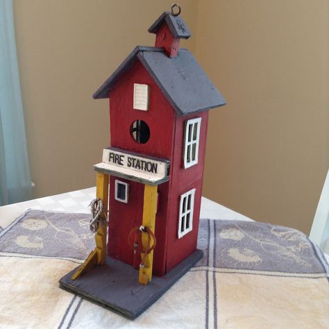 Finished my Fire Department bird house. Fire Station Bird House, Funny Birdhouses, Toad Garden, Barn Birdhouse, Barn Birdhouses, Diy Yard Decor, Squirrel Feeders, House Planter, Rustic Birdhouse