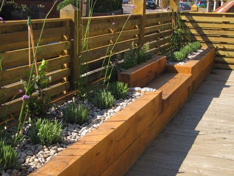 Find Planter Benches. Maybe you just want to sit near your recently planted flowers or you want to use the bench for assistance in kneeling to pull weeds, but either way, you will appreciate these planter benches. Just like the name, they are benches, with planters behind them. Two in one. A fun proje… Backyard Australia, Decorative Raised Garden Beds, Low Fence, Garden Seating Area, Building Raised Garden Beds, Raised Flower Beds, Cheap Backyard, Building A Raised Garden, Backyard Plants