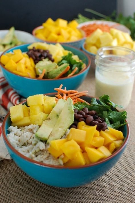 Escape to a warm, tropical destination with this Tropical Coconut Rice Bowl.  Sweet coconut Rice is topped with fresh tropical fruit, black beans, cilantro, avocado and a creamy pineapple dressing making this a nice vegetarian lunch or dinner option. // acedarspoon.com #ricebowl #coconut #vegetarian Tropical Rice Bowl, Cocnut Rice, Coconut Rice Bowl, Pineapple Rice Bowl, Pineapple Dressing, Sweet Coconut Rice, Tropical Rice, Tropical Bowl, Sushi Bowls