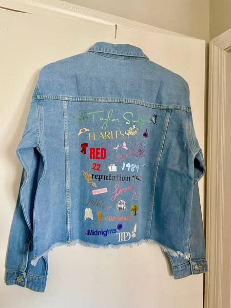 Stay in style with this classic medium wash denim jacket, customized to celebrate all of Taylor's iconic eras. Featuring images representing each album and various songs. Women's Jean Jacket Frayed Washed Button Up Cropped Denim Jacket With Pockets 65% Cotton, 35% Polyester Stylish raw hem, two chest fake pockets, two side slant hand pockets, turndown collar, button cuffs Design is DTF heat transfer decal, hand pressed.  Variations and small imperfections may occur as it is a handmade product, each design pressed individually. Taylor Swift Eras Denim Jacket, Diy Eras Tour Denim Jacket, Taylor Swift Eras Jean Jacket, Swiftie Jean Jacket, Lover Jean Jacket Taylor Swift, Eras Tour Jean Jacket Diy, Taylor Swift Jacket Diy, Taylor Swift Jean Jacket Diy, Eras Tour Jean Jacket