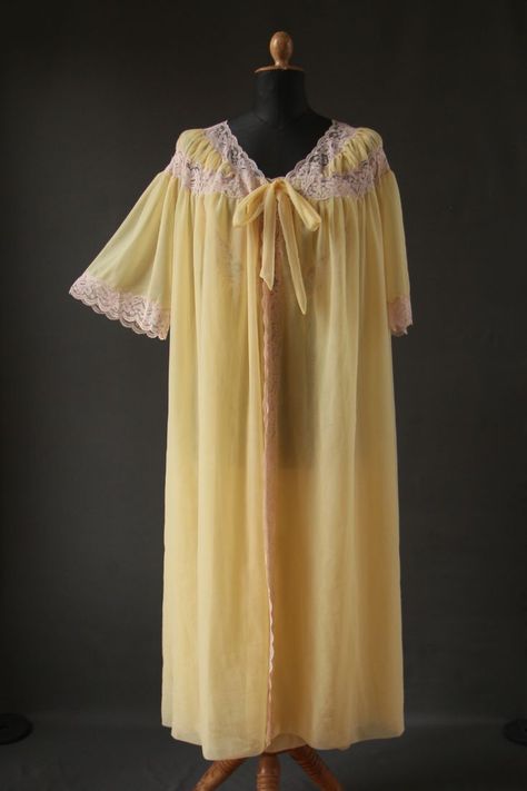 A mannequin wearing a 1960s yellow peignoir set consisting of dressing gown and nightdress in nylon tricot. 1960s Nightwear, Sleepy Core, Lacy Nightgown, 1960s Nightgown, Yellow Nightgown, Twst Oc, 1960s Lingerie, Vintage Peignoir, Dress Wardrobe