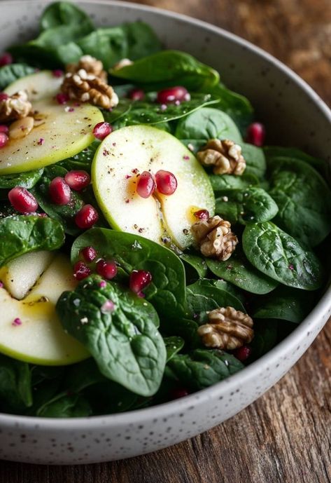 Enjoy a crisp and refreshing Fresh Spinach and Apple Salad that’s perfect for any occasion! This delightful combination of fresh spinach, tart green apples, crunchy walnuts, and juicy pomegranate seeds is not just a feast for the eyes, but also for the palate. Drizzled with a light vinaigrette, this salad is both healthy and delicious. It's a great way to incorporate those vibrant fall flavors into your meals! Pomegranate Spinach Salad Recipes, Spinach Pomegranate Salad, Spinach Tart, Apple Salad Recipe, Salad With Spinach, Homemade Banana Pudding Recipe, Grilled Halibut, Apple Salad Recipes, Homemade Banana Pudding