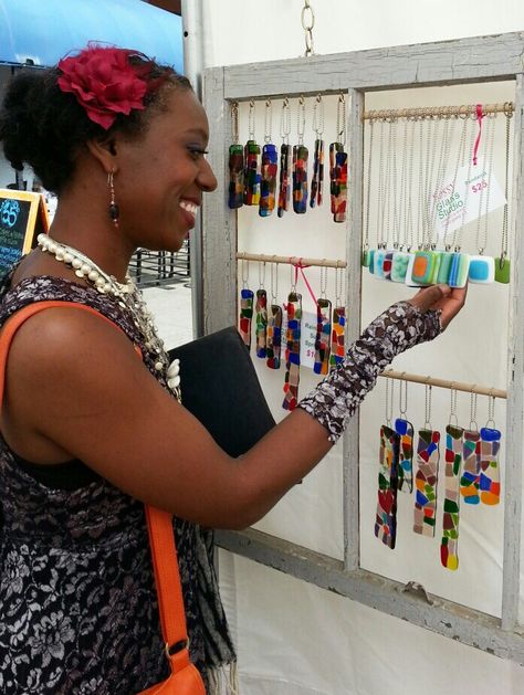 Display for fused glass pendants and small sun catchers created from repurposed window frame. Sassy Glass Studio booth at Dogwood Arts Festival, Knoxville, TN. Sun Catcher Display Ideas, Jewelry Display Booth, Repurposed Window, Studio Booth, Craft Fair Booth Display, Jewelry Booth, Craft Market Display, Craft Booth Display, Jewerly Displays