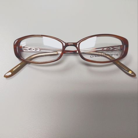 Vintage, Early Y2k Brown, Oval Plastic Eyeglass Frames With Demo Lenses. Metal, Detailed Cut Out Pattern On Temples With Brown, Plastic Temple Covers. Small Flaw In Demo Lens, But The Lenses Are Not Me At To Be Used For Wear. These Are Smaller Style Frame, Very Typical Of The Style Of The Early 2000s. New, Old Stock. Nostalgic Y2k Fashion. 2000s Genre. L227 Model Sk4 Color Brown Eye Width 50mm Eye Height 27mm Bridge 18mm Temple Length 135mm