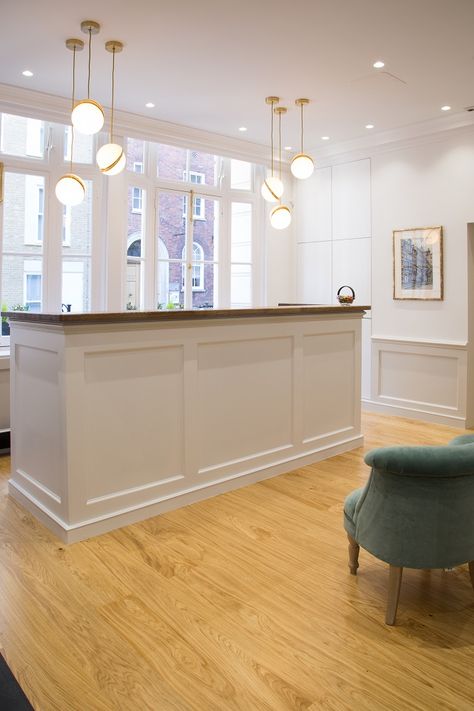 Panelled Reception Desk, Lighting Over Reception Desk, Front Reception Desk, Reception Desk Pendant Lighting, Medical Office Reception Area, Retail Checkout, Bespoke Reception Desk, Office Reception Ideas, Chiropractic Reception Desk