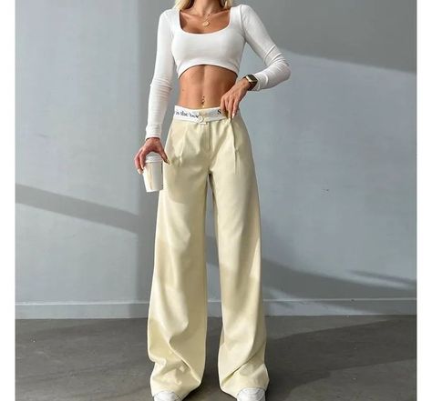 23.87 - USE CODE MAINE23 FOR A DISCOUNT! Hitting the sweet spot between streetwear and formal dressing, these wide-leg pants are designed with a fold-over waistband punctuated with a contrast color and lettering print. The high waist pants with a flowy silhouette would pair well with a skintight crop top. Celana Fashion, Casual Work Pants, Work Pants Women, High Waisted Wide Leg Pants, Waistband Pants, Casual Cargo Pants, Loose Trousers, Leg Work, Work Trousers