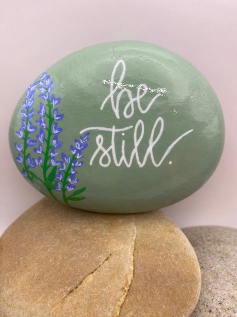 This hand-painted rock is a one-of-a-kind work of art. I use acrylic paint and all lettering and graphics are free-hand. The rock is protected with a sealant to make it suitable for indoor and outdoor purposes. Community Rock Garden, Painted Rocks With Words, Landscape Rock Painting Ideas, Painted Rocks Positive Sayings, Fairy Garden Rocks, Rock Painting Ideas Quotes, In Memory Painted Rocks, Plant Rock Painting, Bible Verse Rock Painting