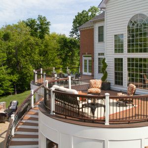 Outdoor Oasis - Chantilly Project - Lauren Nicole Designs - Interior Design in Charlotte, NC Backyard Improvements, Curved Deck, Staircase Outdoor, Deck And Patio, Deck Seating, Double Staircase, Lauren Nicole, Railings Outdoor, Deck Stairs