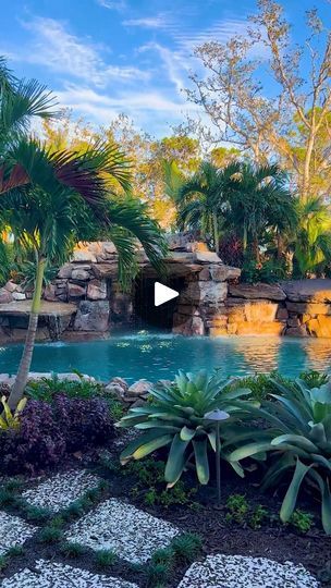 372K views · 28K reactions | This tropical lagoon in Florida was designed to mimic an old Florida swimming hole. Featuring a natural rock grotto waterfall, lush landscaping, and natural rock paths leading you from one destination to another.

#insanepools #lucaslagoons #pool #lagoon #swimminghole | Lucas Lagoons | thecowboycameraman · Slowed Macarena Grotto Waterfall, Pool Lagoon, Houses On Stilts, House On Stilt, Insane Pools, Tropical Lagoon, Rock Path, Lush Landscaping, Lagoon Pool