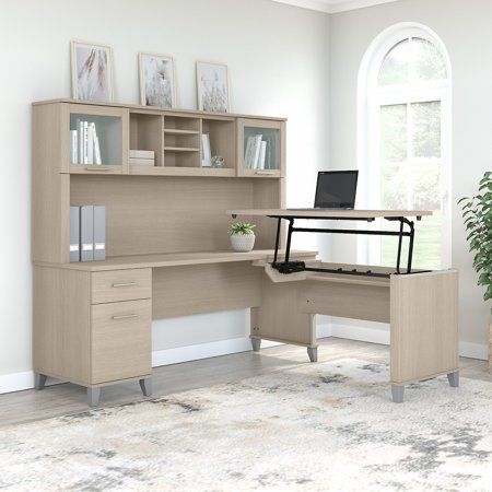 The Bush Furniture Somerset 72W 3 Position Sit to Stand L Shaped Desk with Hutch offers an ideal solution for those seeking a stylish and functional ergonomic workspace. As a quality alternative to desktop risers, the innovative 42W x 24D Sit to Stand Return offers all the health benefits of a standing desk with the versatility of more expensive electric height adjustable options. The built-in mechanical Lift-n-Lock system allows the desktop to lock into place at standing heights of 35, 38, and L Shaped Desk With Hutch, Desk With Hutch, Frosted Glass Door, Desk Hutch, Sit To Stand, Office Set, Bush Furniture, L Shaped Desk, Desk Set