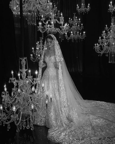 Yogie Pratama on Instagram: "Chandelier surrounds her, yet the level of intricacy and glam behind every drop of crystal upon the attire is simply unmatched. From head to toe she was bathed with blooming floral embroidery, where every inch embellished with crystal swarovski. Grandiose custom embroidered veil engulfed her with luxuriant allure.  #yogiepratama #couture #atelier #bride #reception #glamorous #crystals" Embroidered Veil, Embellished Veil, Vintage Hollywood Glamour, Dream Wedding Decorations, Special Events Decor, Pretty Wedding Dresses, Fancy Wedding Dresses, Fairy Wedding, Wedding Dress With Veil