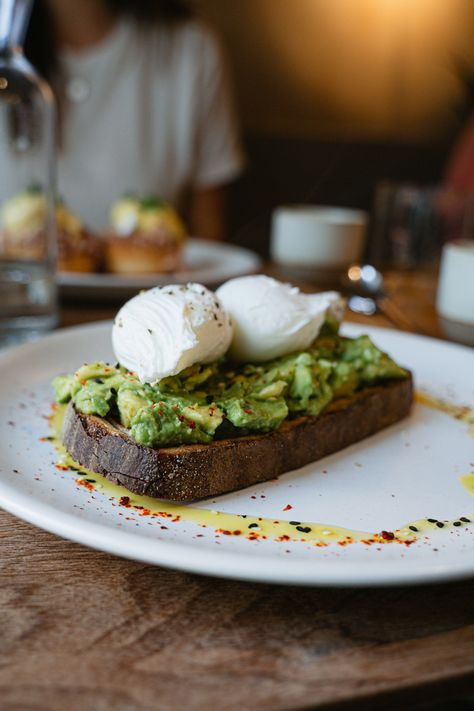 🥑🍞 The Best Avocado Toast Ever! 🥑🍞  We had the most delicious avocado toast at WatchHouse Tower Bridge in Shad Thames, London. Perfectly ripe avocado on hearty toast, topped with poached eggs and a sprinkle of spices. It’s the perfect start to any morning. If you’re in London, this is a must-try!  #AvocadoToast #Foodie #LondonEats #TravelTasteDiscover #BrunchGoals #WatchHouseCafe Poached Egg Toast, Poached Eggs Avocado Toast, Avocado Toast With Poached Egg, Gourmet Avocado Toast, Poached Egg On Avocado Toast, Avocado Poached Egg Toast, Pesto Egg Toast, London Eats, Egg Toast