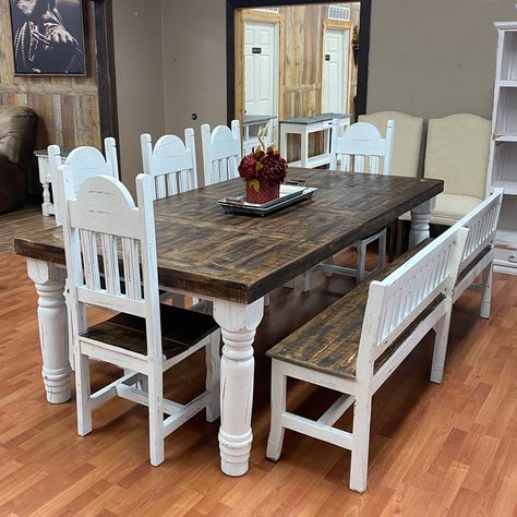 This 8' dining set comes in a beautiful two tone stain with a bright white distressed base. The set includes the table, 5 chairs, and the backed bench shown. Pair it with our Gatlinburg Hutch to complete your dining room. For any questions, call us at 940-440-0455 and we will be happy to help.    LTMES15TABLESET-WD Farmhouse Dining Room Table Sets, Dinning Room Table Distressed, Farmhouse Table With Captain Chairs, Farmhouse Table And Chairs Kitchen, Farmhouse Table With Gray Chairs, Farmhouse Table And Chairs The Home Depot, Diningroom Hickory Table With White Chairs, Farmhouse Dining Room Table Rustic, White Distressed Dining Room Table