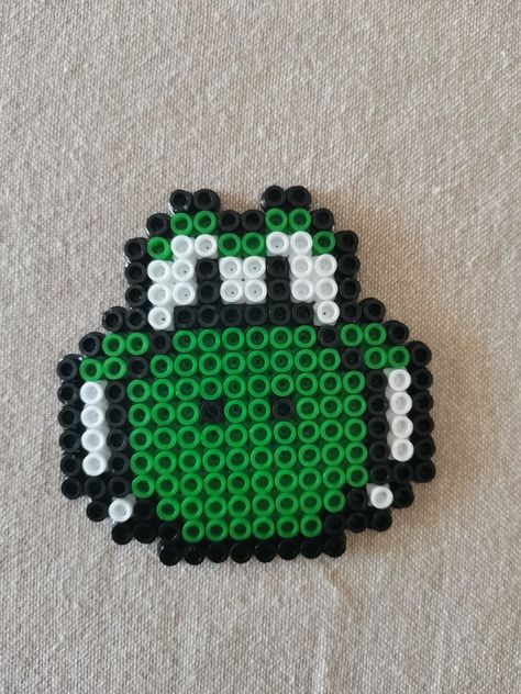 I tried making Yoshi from Super Mario with perler beads. Perler Bead Video Game Controllers, Mario Fuse Bead Patterns, Mario Hama Beads Pattern, Mario Fuse Beads, Perler Beads Yoshi, Pearler Bead Mario, Yoshi Perler Bead Patterns, Yoshi Craft, Super Mario Perler Bead Patterns