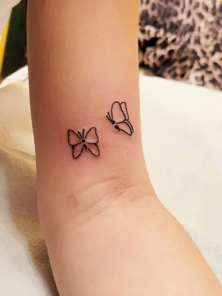 Butterfly Semi Colon Tatoos, Butterfly Tattoo With Hidden Semicolon, Tattoo Idea Semicolon, Semi-colon Butterfly Tattoo Minimalist, Fine Line Tattoo Semi Colon, Wrist Tattoos For Women Small Semi Colon, Simple Tattoos Semi Colon, Book Semicolon Tattoo, Minimalist Tattoo Semicolon