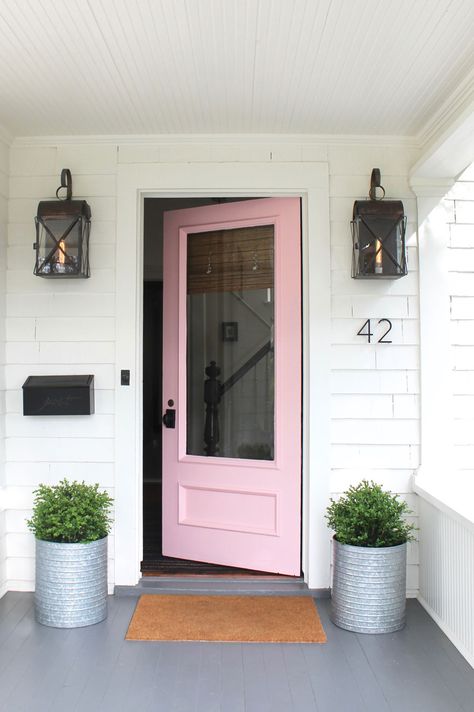 We painted our door pink and it looks like Spring has arrived with new planters of boxwoods! Plus we love our new Emtek door hardware. Pink Front Door, Spring Porch Decor, Salon Suites, Pink Door, Painted Front Doors, Small Front Porches, Front Door Colors, House With Porch, Front Porch Decorating