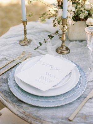 Dusty Blue Coastal Wedding Place Settings || Plating: White Glove Rentals. Rentals: Something Vintage. Planning + Styling: Ida Rose Events. Photography: Nichole R. Meredith for Renee Hollingshead. Venue: Chesapeake Bay Beach Club. Flowers: Steelcut Flower Company. Invitation Suite + Calligraphy: Wildhearts Calligraphy. Book Calligraphy, Blue Place Settings, Blue Charger, Wedding Plate Setting, Charger Plates Wedding, Card Calligraphy, Venue Illustration, White Charger, Bespoke Invitations