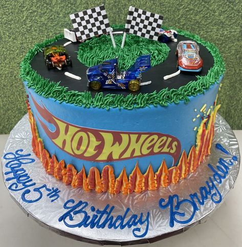 Fondant track with paper checker flags, edible image of hot wheels logo and buttercream flames up the side. Cars on top Hot Wheels Cake 2nd Birthday, Hotwheels Buttercream Cake, Buttercream Flames On Cake, Buttercream Race Car Cake, Hot Wheels Birthday Party Ideas Shirts, Hot Wheels Themed Cake, Hot Wheels Buttercream Cake, Hot Wheels Birthday Party Cake, Hot Wheels Cake Simple