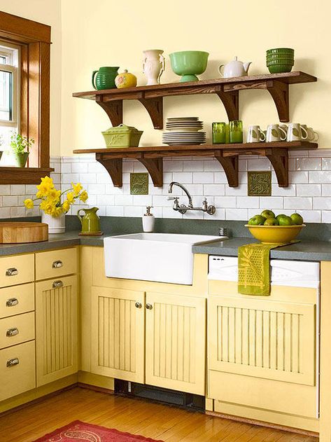 "I like yellows that have subtle reddish or brown undertones," Marlaina says, because they’re more compatible with other colors. Here, honey yellow compliments the wood and helps the green accents to sing. Kitchen Shelf Design, Yellow Kitchen Designs, Yellow Kitchen Cabinets, Yellow Cabinets, Tuscan Design, Tuscan Kitchen, Open Kitchen Shelves, Regal Design, Yellow Kitchen