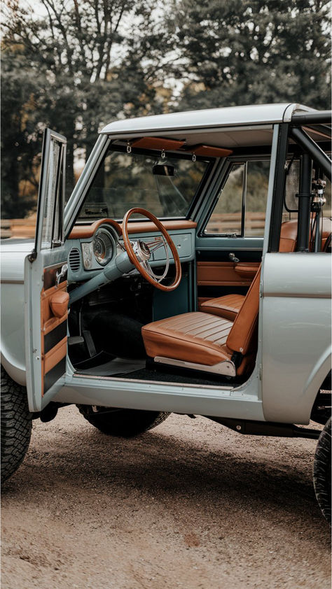 Vintage Ford Bronco with its door open showing the sleek and stylish interior upgrades Old Ford Interior, Old Bronco Vintage, Vintage Bronco Aesthetic, 4x4 Aesthetic, Old Cars Vintage Aesthetic, Ford Bronco Aesthetic, Bronco Aesthetic, Ford Bronco Interior, 1970 Bronco