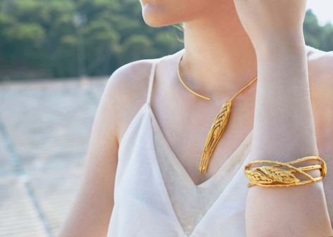 Demetra Wheat Bracelet: An elegant synthesis of nature's warm beauty symbols, featuring a intertwining natural twigs and elegant wheat motifs all dressed up in gold. | Demetra Wheat Necklace: Embodying the warmth and elegance of greek summertime, this elegant necklace featuring a double wheat motif, draws its isnpiration from the greek goddess of growth and harvest, Demetra.  #gold #jewelry #thallo #wheat #greekgoddes #beauty Beauty Symbols, Capitol Couture, Greek Dress, Golden Wheat, Real Flower Jewelry, Extraordinary Women, Greek Jewelry, Elegant Necklaces, Classic Collection