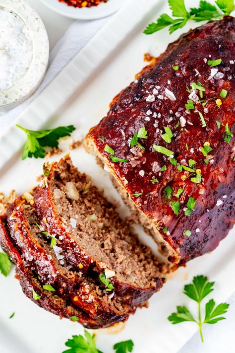 This Ninja Foodi Grill Meatloaf is easy to make, has simple ingredients, and is sure to be a hit at your next family dinner. It is packed with flavor, and the Ninja Foodi Grill gives it a perfect char. You'll love how easy this recipe is to follow, and your family will love how delicious it is. Individual Meatloaf, Grilled Meatloaf, Basic Mashed Potatoes, Traditional Meatloaf Recipes, Meatloaf Topping, Bacon Wrapped Meatloaf, Traditional Meatloaf, Classic Meatloaf Recipe, Classic Meatloaf