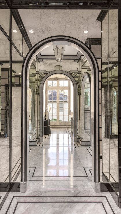 Glam master bathroom features an arched doorway framed by antiqued mirrored walls atop gray marble floors accented with black moldings. Grey Marble Floor, Marble Floors, Mirrored Wall, Marble Flooring, Home Luxury, Home Modern, Entry Way, Marble Floor, Floor Patterns