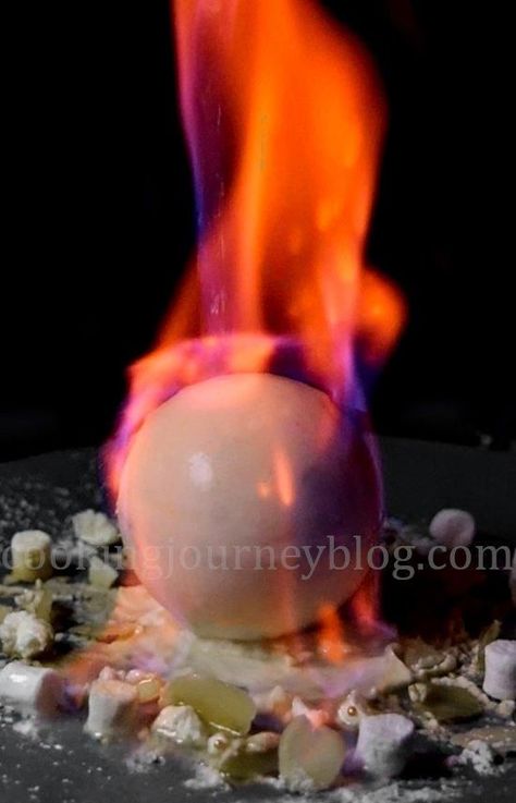 Flaming Chocolate Ball. Easy winter dessert, melting chocolate. Great dessert for holidays, light up Christmas! #dessertrecipes #christmasdesserts #snowballs Melting Chocolate Ball Dessert, Flaming Desserts, Easy Winter Dessert, Fire Desserts, Flambe Desserts, Modern Desserts, Chocolate Balls Recipe, Winter Desserts Easy, Chocolate Desserts Fancy