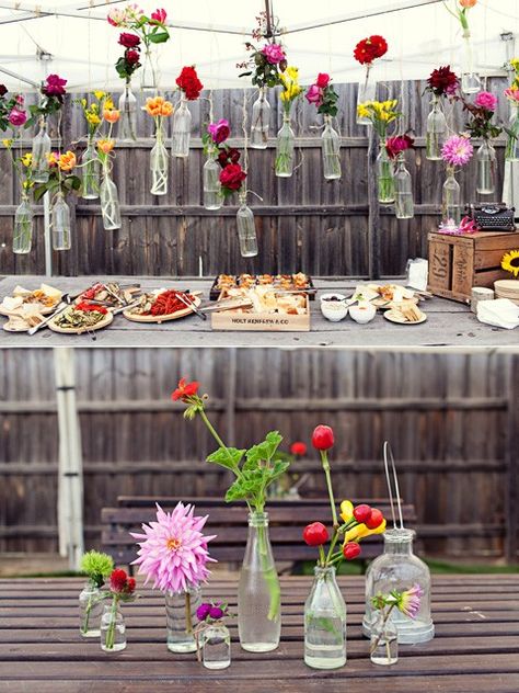 Simple glass bottles and flower display. Perfect decor for a garden party! #designsponge #dssummerparty Decoration Buffet, Summer Party Decorations, Garden Party Decorations, Easy Backyard, We Get Married, Budget Friendly Decor, Budget Backyard, Garden Parties, Deco Floral