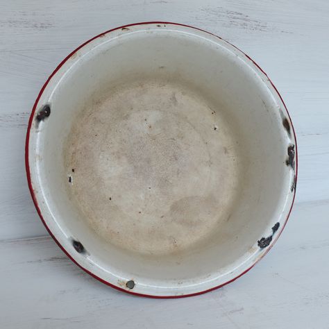 "Medium white enamel bowl with red stripe likely from the 1950's. Bowl is in good vintage condition with several chips in the enamel and mineral stains. See photos for details. Measures 10 3/4\"\" in diameter x 3\" tall. Visit my shop to see a wide selection of vintage goods. https://www.etsy.com/shop/ArborEssence Ships FREE to the contiguous U.S. States only. For other destinations, please contact us. Follow ArborEssence on Facebook and Instagram! FB: https://www.facebook.com/ArborEssence IG: @ Antique Dishes Collectible, Shallow Shelves, Vintage Lampshades, Vintage Kitchen Accessories, Vintage Glassware Antiques, Enamel Ware, Vintage Thermos, Yellow Mugs, Antique Dishes