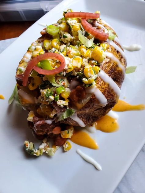 Jacket potatoes are my absolute fave thing ever. What's better than an entire meal stuffed inside a potato? We've got tender pinto beans, melty cheddar, a creamy esquites salad, saucy action, and pickled onions. Recipe link attached <3 Mexican Jacket Potato, Esquites Salad, Pickled Onions Recipe, Mexican Pinto Beans, Jacket Potatoes, Chipotle Crema, What Can I Eat, Jacket Potato, How To Cook Beans