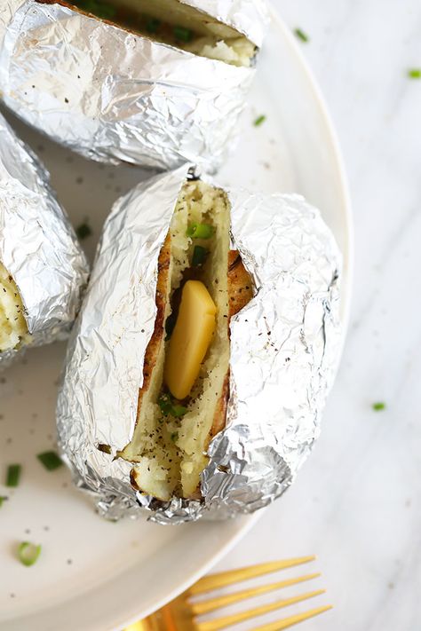 One of our fav sides is a baked potato in foil. Whether you want to make a grilled baked potato in foil or oven baked potatoes in foil, we'll teach you how to make both! How To Bake Potatoes In Oven In Foil, Baked Potatoes In Oven With Foil, Baking Potatoes In Oven With Foil, Best Baked Potatoes In The Oven In Foil, Foil Baked Potatoes Oven, Baked Potatoes On The Grill In Foil, Foil Wrapped Baked Potatoes In The Oven, Oven Baked Potato In Foil, Baked Potatoes In Foil In The Oven