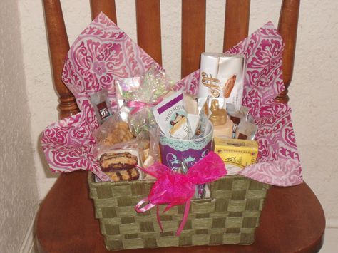 Fancy gift basket I made for a grand prize for shower games. Take a basket from Joanne's or Micheal's and fill with tissue paper, chocolates, crackers, teas, and coffee from around the world. It was a coveted prize. High End Raffle Basket Ideas, Gift Basket With Cellophane, How To Put Tissue Paper In A Gift Basket, Gift Basket Wrapping Cellophane, Wrapping With Tissue Paper, Raffle Baskets People Actually Want, Basket Wrapping, Basket Display, Fundraiser Baskets