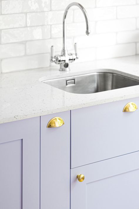 There's a definite trend towards adding colour to a kitchen   This beautiful lilac kitchen in our Bloomsbury project shows how colour doesn't need to be scary   The draw fronts are in a beautiful lacquered pale lilac, with gold handles and drawer pulls, a soft grey composite worktop and hand glazed high gloss rectangular tiles for the backsplash   For more design details and tips see our website Lilac Kitchen, Rectangular Tiles, Hallway Paint, Joinery Design, London Interior, Pale Lilac, Home Automation System, Grey Kitchen Cabinets, Studio Interior