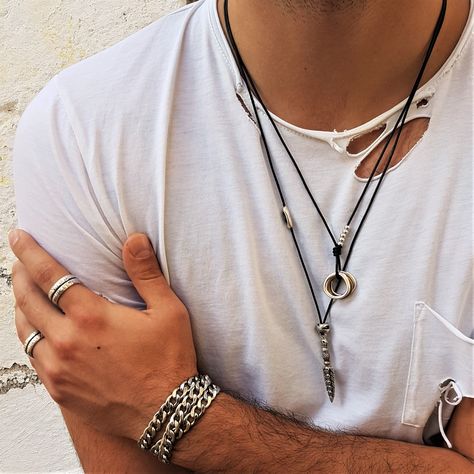 A unique and stylish leather necklace featuring an O ring pendant with circle charms. Perfect for men or women, this necklace is made from high-quality leather and is sure to turn heads wherever you go.

#leathernecklace #unisexnecklace #oringsnecklace https://whispers-in-the-wind.com/discover-the-latest-mens-accessory-trends-for-2024/?elegant-mens-leather-blazer-premium-genuine-leather-jacket-stylish-formal-casual-wear Men’s Leather Necklace, Leather Necklace For Men, Male Rings, Mens Leather Blazer, Mens Leather Jewelry, Mens Leather Necklace, Bohemian Style Men, Trendy Mens Haircuts, Ring Leather