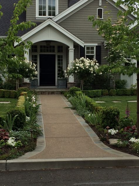 Layering with boxwoods - could do this along sidewalk to front door. Path To Front Door Landscaping, Landscaping Sidewalk To Front Door, Walkway To Front Door Landscaping, Straight Walkway To Front Door, Sidewalk From Garage To Front Door, Long Sidewalk To Front Door, Flower Bed Along Sidewalk Front Walkway, Sidewalk To Front Door, Curved Sidewalk To Front Door