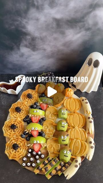 Melissa on Instagram: "SPOOKY BREAKFAST BOARD💀🎃👻🕷️🕸️

Welcome to episode 22 of @melissas_healthykitchen spooky eats series. Today it’s how to make a spooky breakfast board. Such a fun, festive, and delicious breakfast or snack idea for spooky season.

Save this post for later and follow along for more spooky eats!

What’s on the board:
1. Gluten free waffles 🕸️💀🎃
2. Apple monsters
3. Kiwi Frankenstein’s 
4. Spiders on a log
5. Grape eye balls
6. Pumpkin cuties
7. Ghost bananas
8. Blueberries
9. Grapes

Which tutorial do you want to see first, comment below.
.
.
#breakfastboard #spookyeats #spookyfood #halloweenbreakfast #festivefood #spookybreakfast #waffleboard #snackboard #halloweenfood #halloweensnacks #spookysnacks" Halloween Breakfast Board, Kiwi Frankenstein, Ghost Bananas, Apple Monsters, Spooky Fruit, Spooky Breakfast, Witch Watch, Halloween Snacks For Kids, Halloween Breakfast