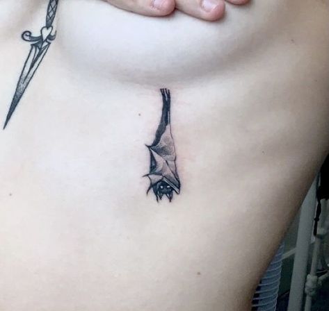 Vampire Goth Tattoo, Aesthetic Bat Tattoo, Tiny Vampire Tattoo, Bat And Butterfly Tattoo, Cool Bat Tattoos, Delicate Bat Tattoo, Bat Tattoo Under Breast, Wraparound Ankle Tattoo, Bat Hanging Tattoo